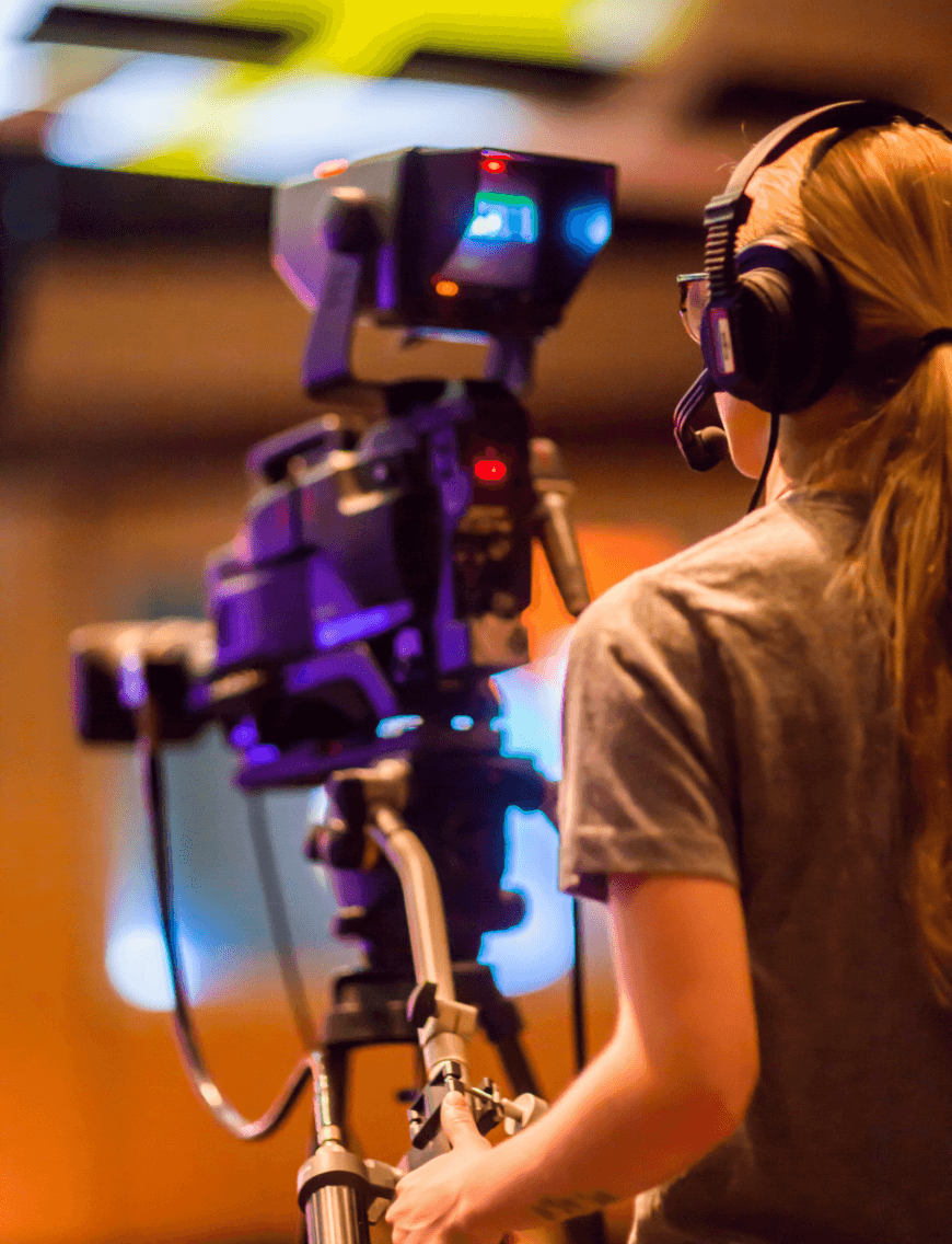 camera woman with headphones